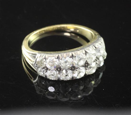 An early 20th century gold, silver and diamond cluster ring, size L.